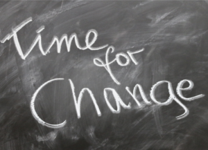 blackboard with time for change written in chalk