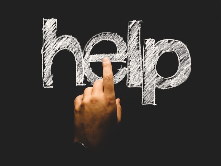 HELP written on a chalkboard