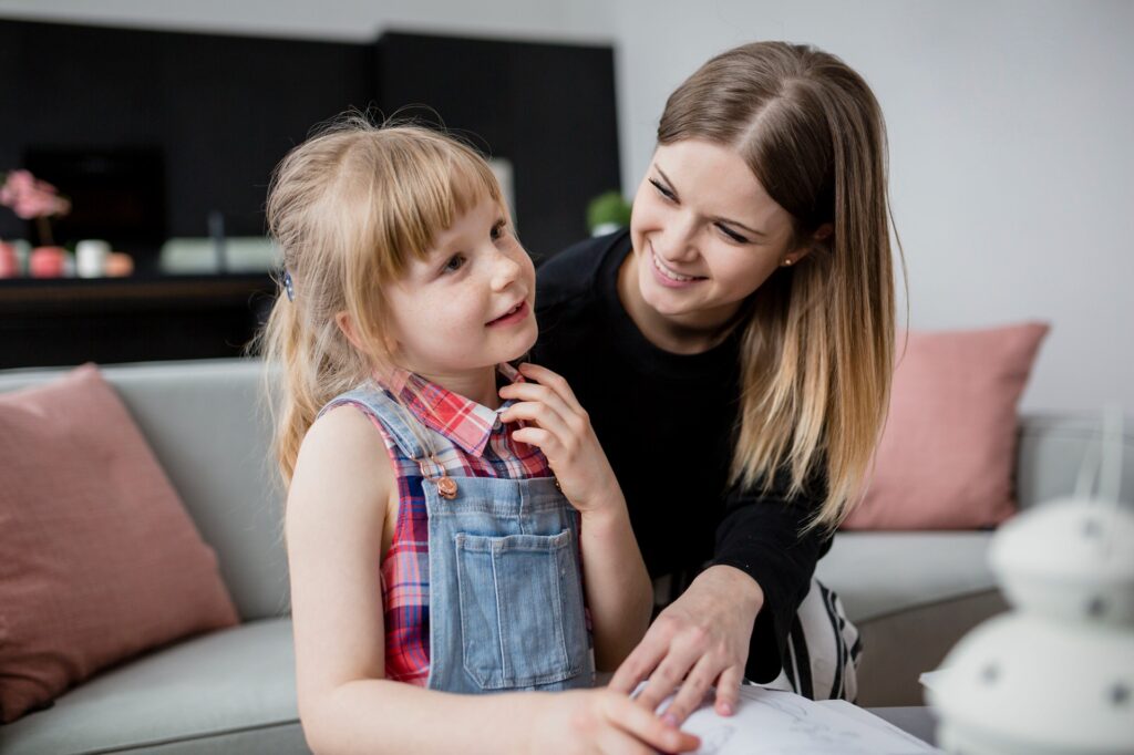 A child and a therapist working together, illustrating the implementation of the ARC model