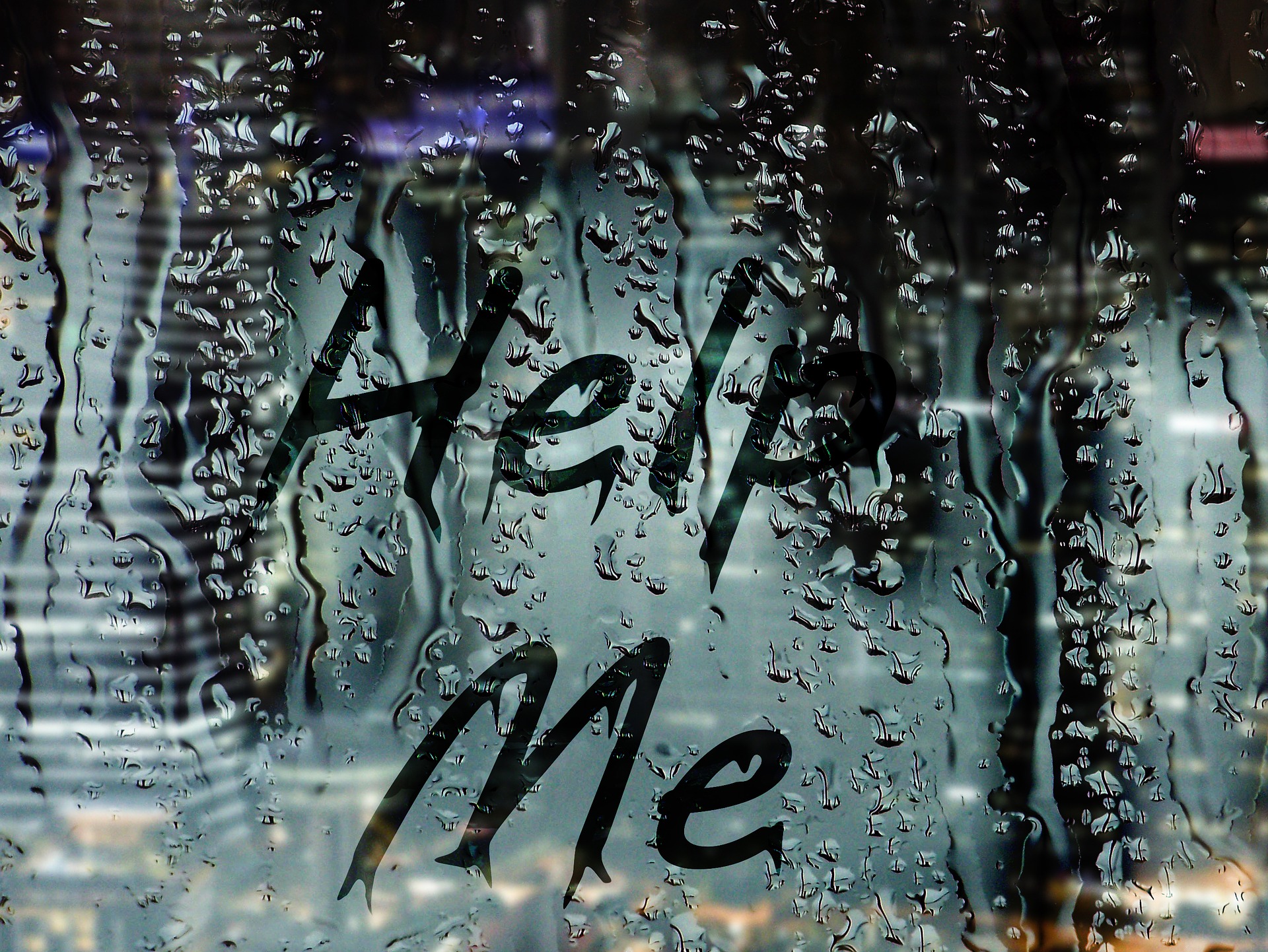 Help Me written in window condensation